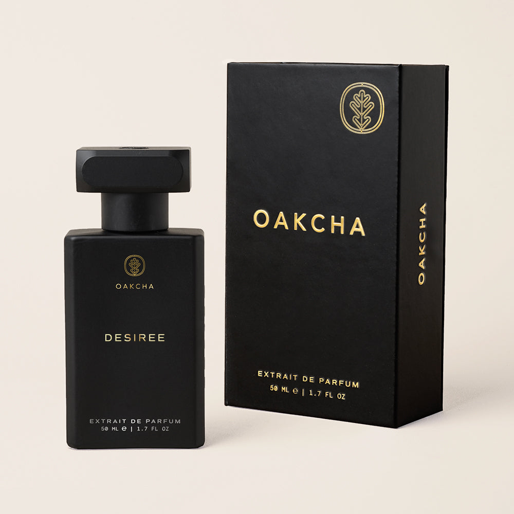 Black Oakcha perfume bottle and packaging on a beige background