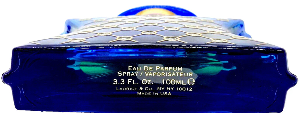 Blue perfume bottle with geometric design on a white background