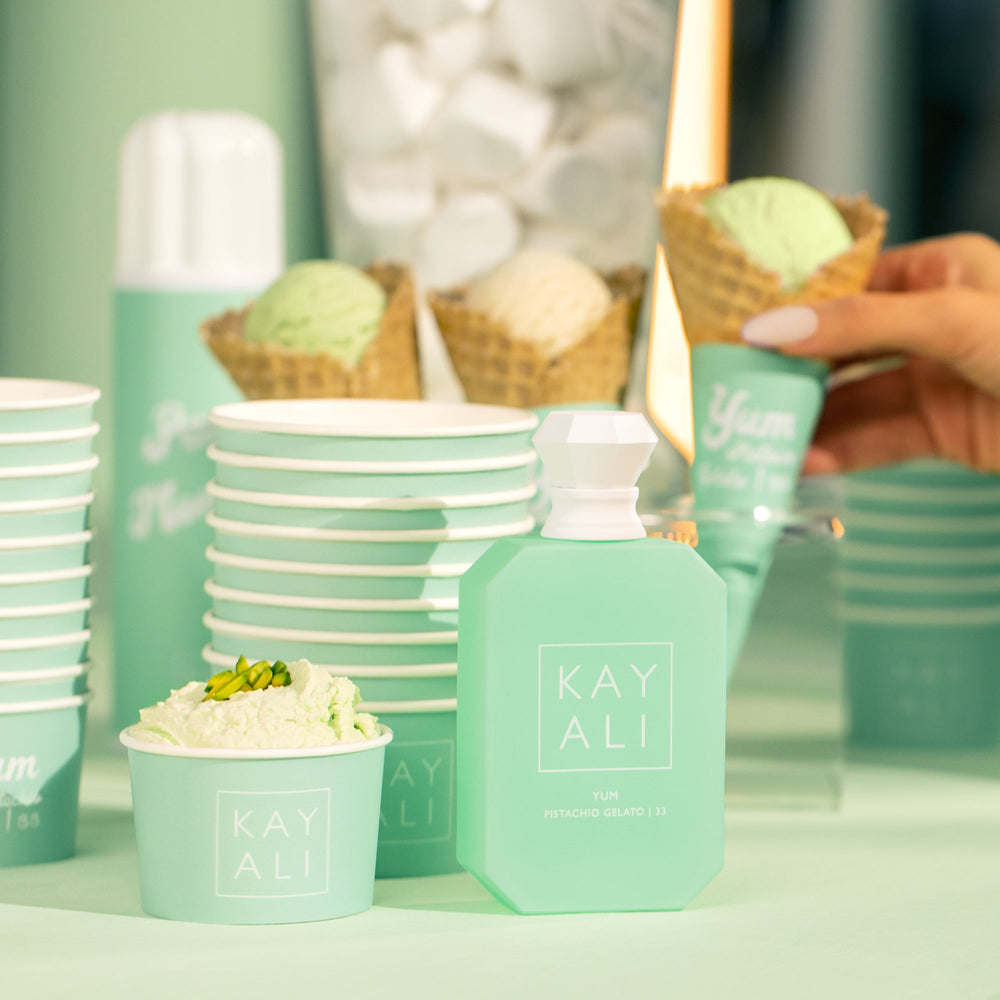 Mint green 'KAY ALI' products including bottles, bowls, and ice cream cones on a light background.