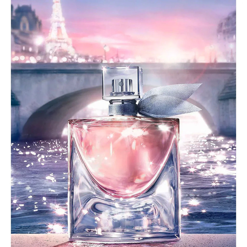 Pink perfume bottle with Eiffel Tower in the background