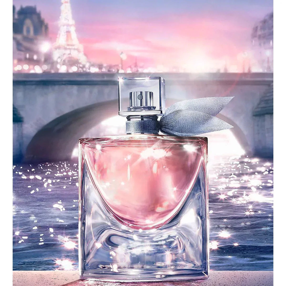 Pink perfume bottle with Eiffel Tower in the background